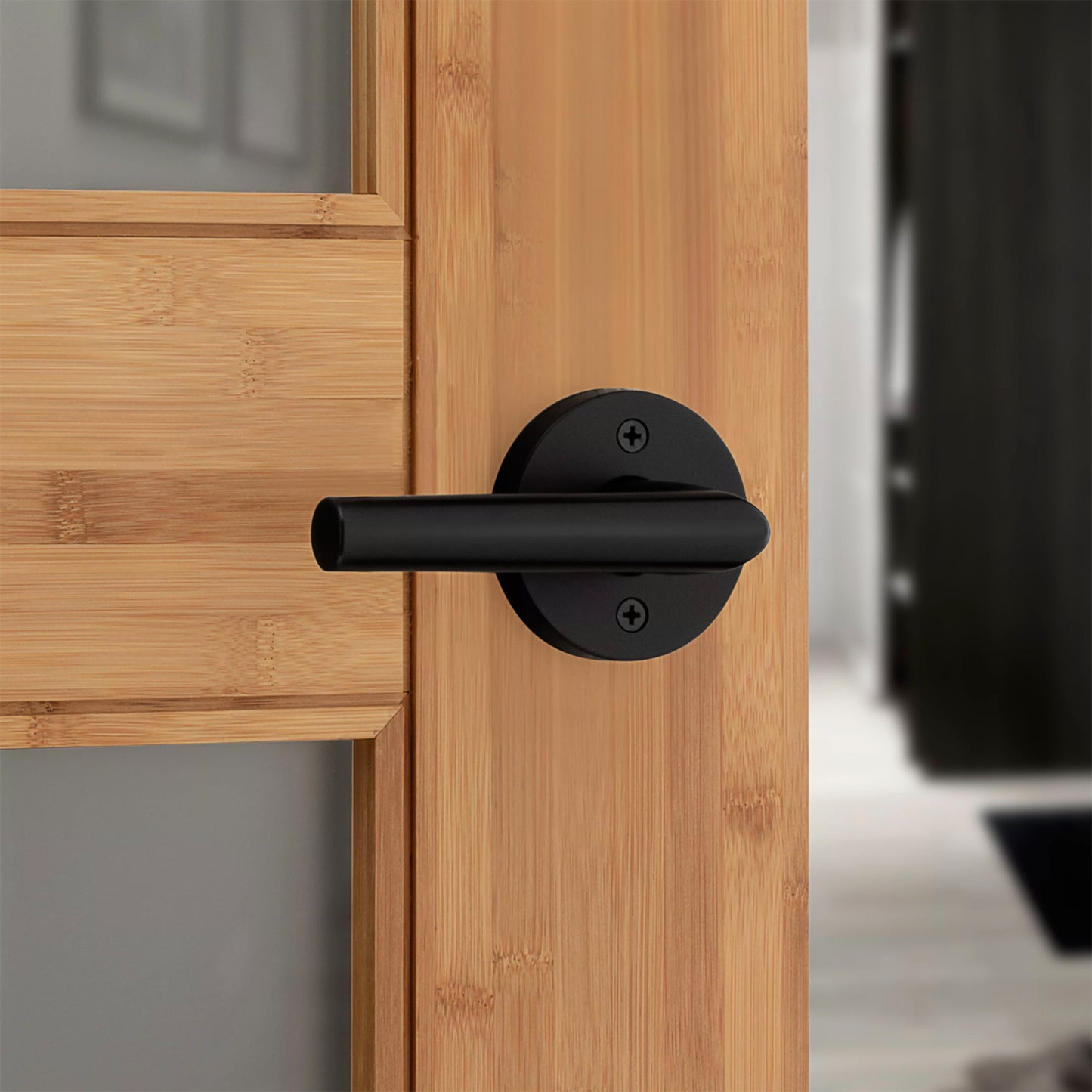 Kwikset Round Milan Lever Handle for Bedrooms and Bathrooms in Matte Black Finish